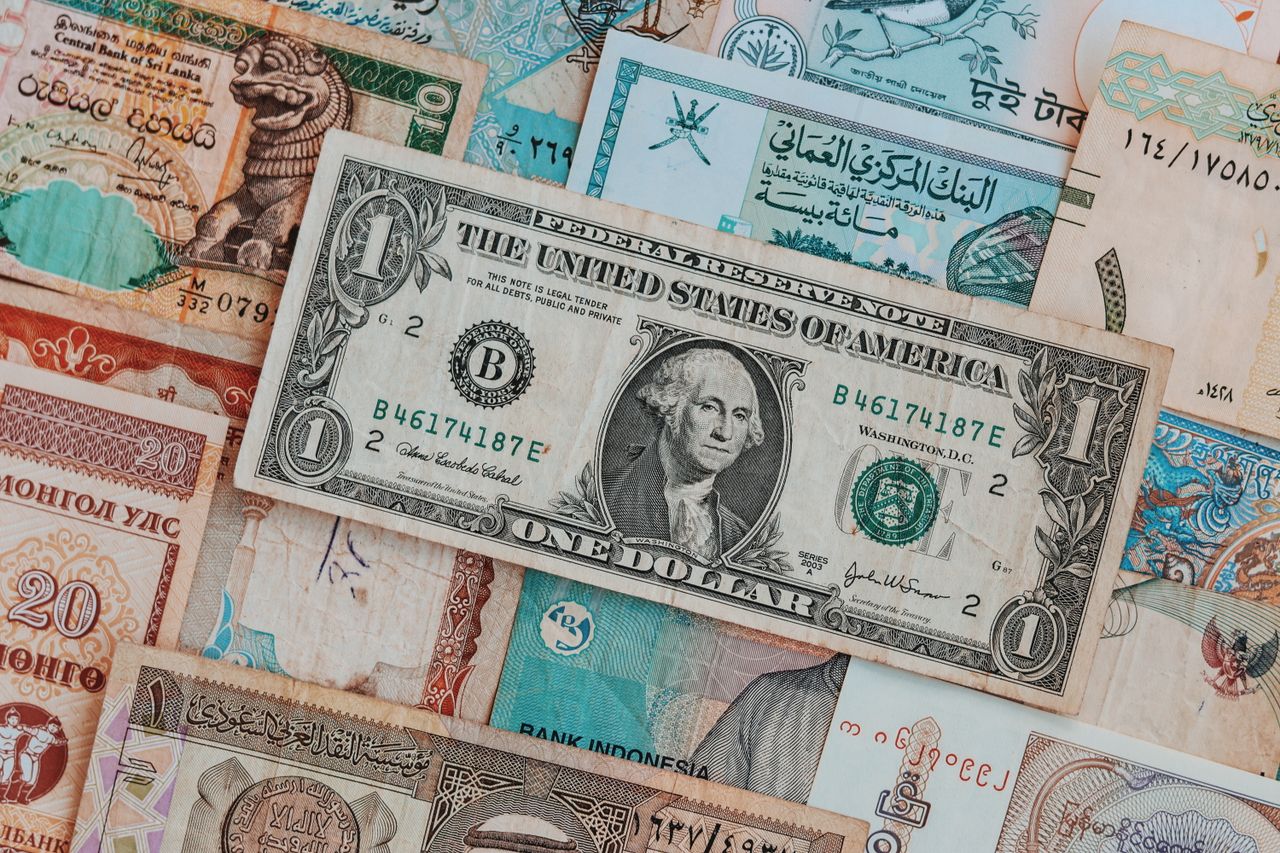 Home Top view of assorted paper money with American greenback representing image of President and numbers with words and signature on bill