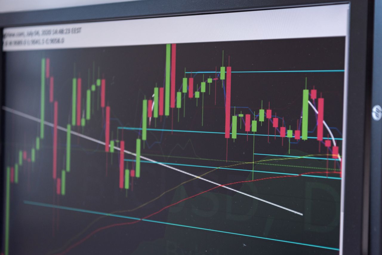 Offerings A close-up view of a cryptocurrency trading chart displayed on a monitor, showcasing market trends.